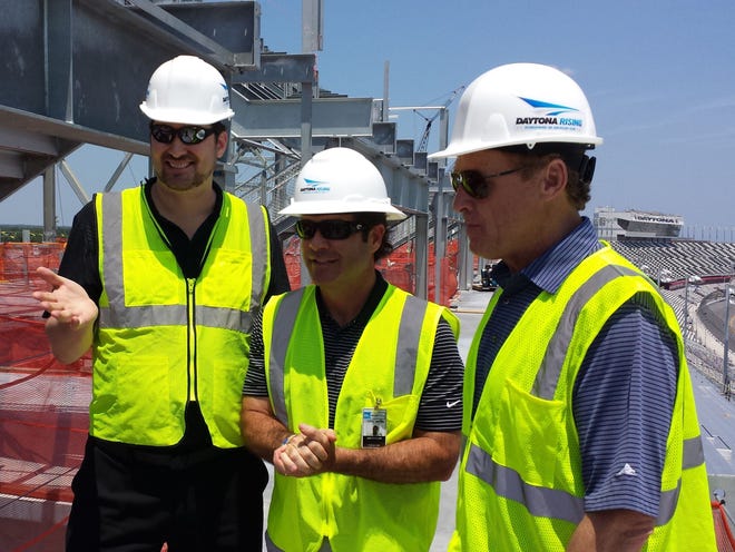 Phil Hellmuth, left, Joie Chitwood III and Rusty Wallace talk racing atop the Daytona Rising project on Monday.