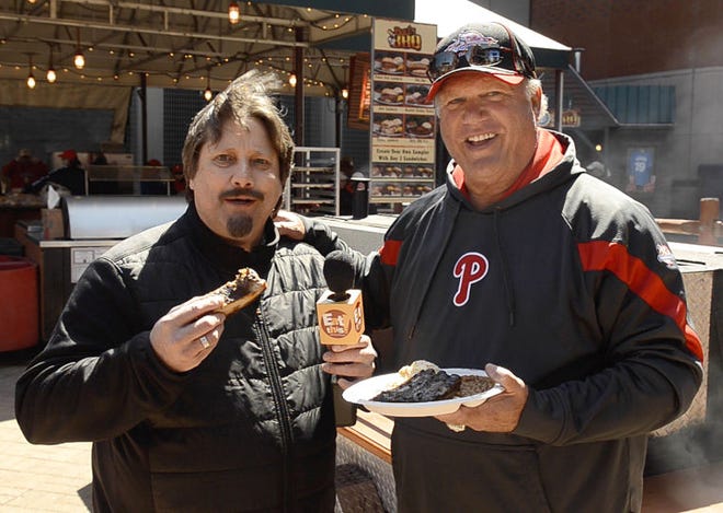 Eat This host Chuck Thomas samples Bull's BBQ ribs with the help of owner Greg "The Bull" Luzinski, during a recent Philadelphia Phillies game at Citizen's Bank Park. During this episode Chuck eats his way around the park and finds some really good eats along the way. photo by Bill Fraser