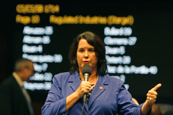 Florida Sen. Kelli Stargel, R-Lakeland, answers questions on the Senate floor, Monday, April 28, 2014, on her Growler Bill SB 1714 on second reading, in Tallahassee, Fla. SB 1714 would allow micro-breweries selling up to 2,000 kegs a year of their own brew to sell growlers of any size. But if they sell more than 2,000 kegs, they would be prohibited from selling their brew in sealed cans or bottles for home consumption directly from the microbrewery.