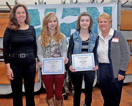 Alia Gams, second from left, and Samantha Boucher, eighth-graders at Hampton Academy were two of four recipients of the Hampton Arts Network Scholarship program. They each received a $250 scholarship to attend the Currier Museum School of Art this summer during the organization's annual meeting. With the students are Norma Torti, president of the Hampton Arts Network, left, and Marilyn Richkofski, chairwoman of the scholarship committee.