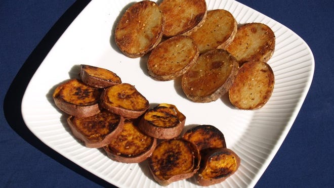 Sautéed in olive oil, these spicy “coins” of sweet (left) and white potatoes make a nice snack. (Photo by GHOLAM RAHMAN)