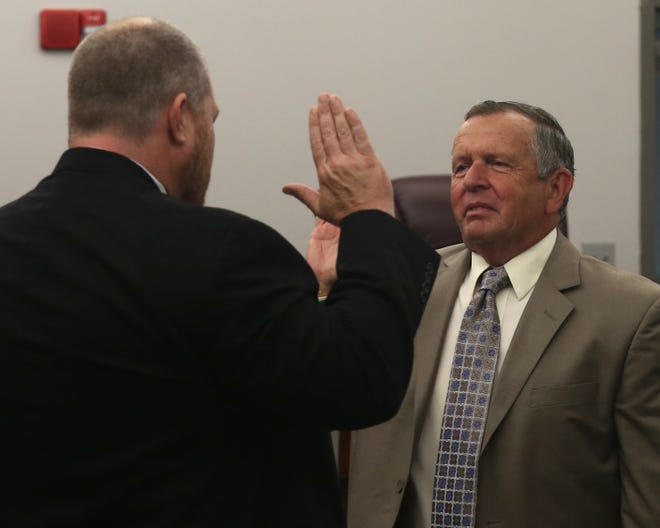 Councilman Bob Pelletier is sworn in by Judge Shane Vann. Callaway officials held a special meeting on Tuesday to swear in board members at the Callaway Arts and Conference Center.