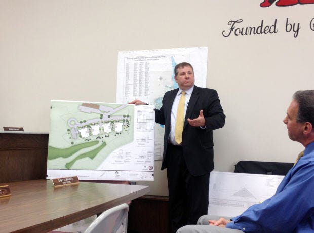 Civil engineer David Hornicak of Stantec presents plans for the Green House homes at 2500 Hospital Drive in Aliquippa during Wednesday's planning hearing commission meeting on the project. David Fenoglietto, right, president and CEO of Lutheran SeniorLife, looks on.