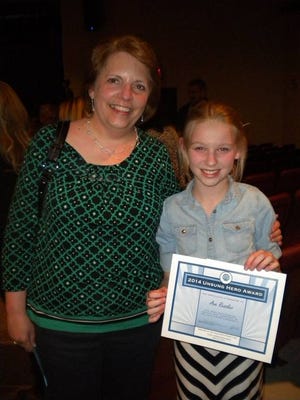 Teacher Mary Ann Shatto stands with Ava Ressler April 22, who she nominated for the Optimist Club's “Unsung Hero Award.”