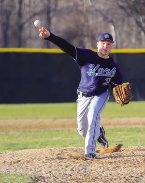 York sophomore Sam Johnson delivers a pitch against rival Traip in season opener.