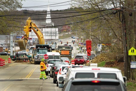 A steady stream of traffic moves slowly along Lafayette Road in Portsmouth with ongoing construction near Cross Roads House and the Bowl-A-Rama.
