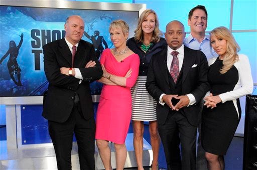 "Good Morning America" co-host Lara Spencer, third left, poses with "Shark Tank" moguls, from left, Kevin O'Leary, Barbara Corcoran, Daymond John, Mark Cuban and Lori Greiner. The show, now in its fifth season, airs Fridays at 9 p.m. EDT.
