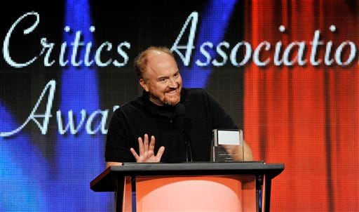 FILE - Louis C.K. picks up the award for Individual Achievement in Comedy for his television series "Louis" at the 2013 TCA Awards at the Beverly Hilton Hotel on in this Aug. 3, 2013 file photo taken in Beverly Hills, Calif. Louie, who (like Louis) is a New York comic and a divorced father of two daughters, knows struggle and angst and cloudy wonderment. The fourth season kicks off Monday May 5, 2014. (Photo by Chris Pizzello/Invision/AP)