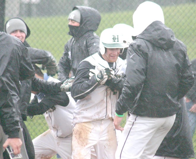 Teammates greet Herkimer County Community College General Tyler Phillips (center) at home plate after he scored the winning run in the eighth inning of the second game of Tuesday's doubleheader against Mohawk Valley Community College.



Times Photo/Jon Rathbun