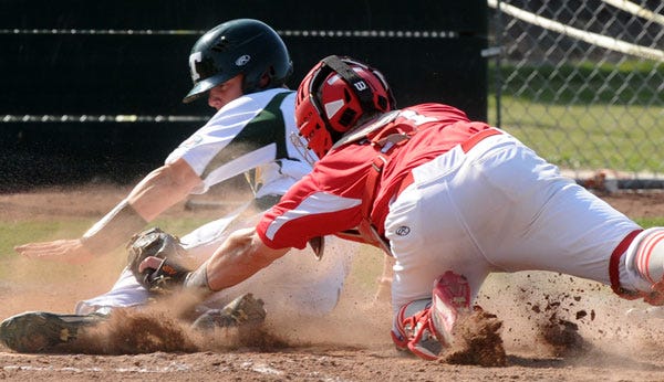Lodi catcher Matt Brooksher puts the tag on Tracy baserunner Thomas Greely during the second inning of Wednesday’s SJAA game.