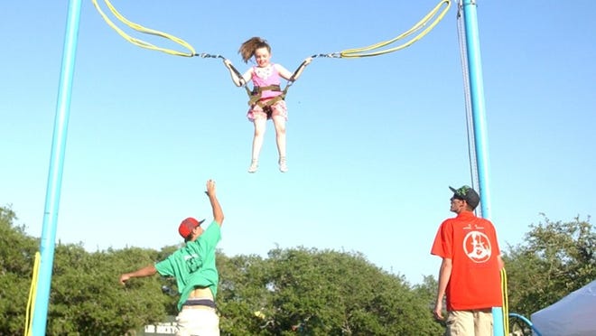 Natalie Gerlach, 6, bungees at the April 25 Lake Travis Chamber of Commerce Spring Fest.