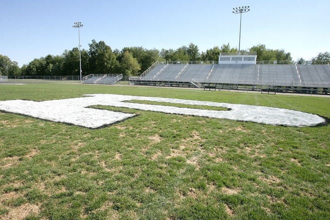 Perry Stadium’s field shows wear prior a game on Sept. 12, 2012. The Perry Local Board of Education approved the installation of artificial turf at the stadium in time for the 2014 high school football season.