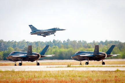 An F-16 Fighting Falcon takes off while two F-35 Lightning IIs taxi during a training mission April 24, at Eglin Air Force Base. F-16s from the 419th and 388th Fighter Wings from Hill AFB, Utah, conducted their first training missions alongside the Air Force’s newest fighter aircraft.