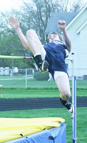 A-W’s Eric Bryan competes in the high jump at the Moss Relays Friday night.