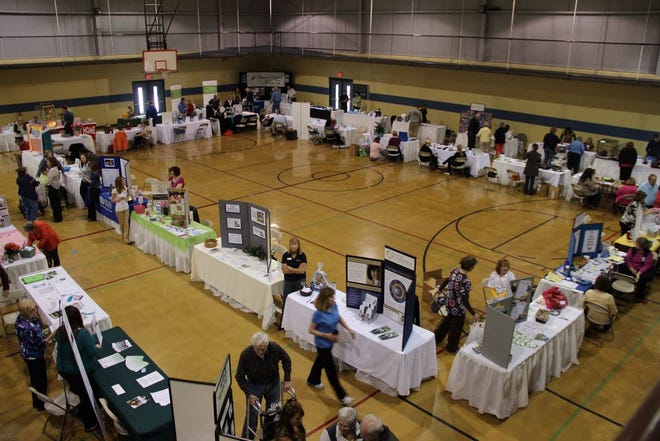 Attendees of the 2013 Senior Expo mill around the event, talking with vendors and picking up various pieces of information.