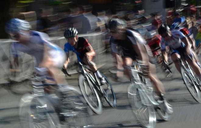 Riders compete in the Twilight Criterium Amateur Finals on Saturday, April 26, 2014 in downtown Athens, Ga.  (Richard Hamm/Staff) OnlineAthens / Athens Banner-Herald