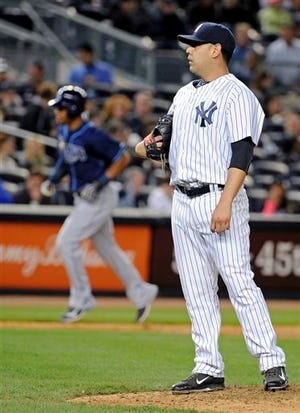 Yankees' Vidal Nuno, right, reacts while Rays' Desmond Jennings rounds the bases for a home run in the fifth inning.