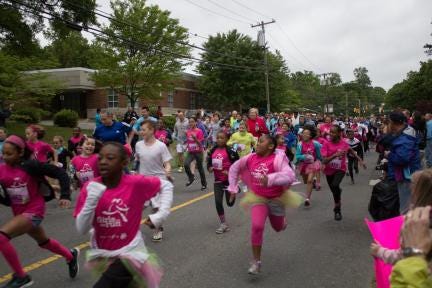 Participants compete in a previous Girls on The Run event at Lineberger Park.