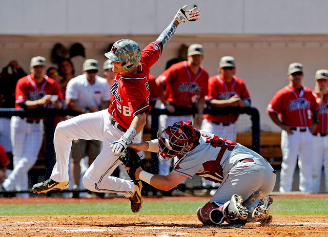 Arkansas catcher Jake Wise tags out Mississippi's Brantley Bell (28) at home plate during an NCAA college baseball game at Oxford-University Stadium in Oxford, Miss., on Saturday, May 3, 2014. (AP Photo/The Daily Mississippian, Thomas Graning)