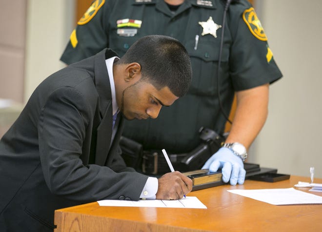 Andrew Persaud fills out paperwork after he pleads no contest to one DUI-related charge at the Marion County Courthouse in Ocala on Monday.