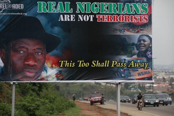 Nigeria President, Goodluck Jonathan, is pictured on a bill board, in Abuja, Nigeria, Tuesday, May 6, 2014. Nearly 300 teenage schoolgirls, were abducted from a school in the remote northeast of Nigeria three weeks ago.