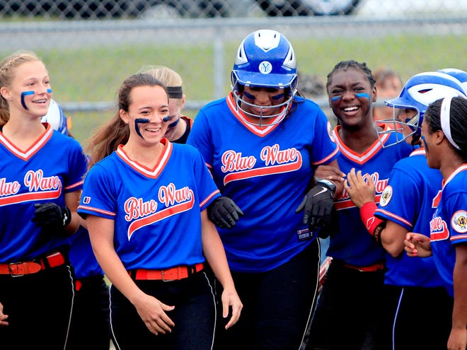P.K. Yonge senior Kalen McGill celebrates with her teammates after hitting a home run against Fort White during the District 5-4A semifinals on April 15. The Blue Wave defeated the Indians 14-0.
