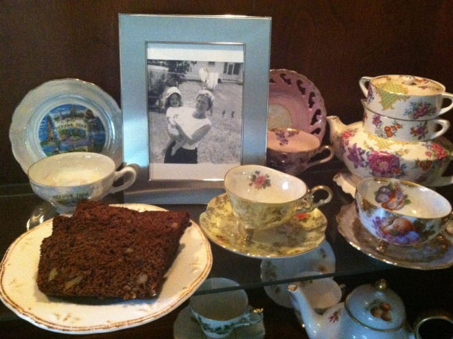 A slice of the Date Nut Bread that Anne Lefebvre would enjoy with her “Memere,” seen in the framed photo, on her grandmother’s special china.