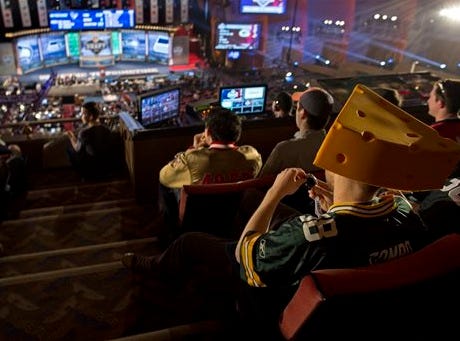Fans crowd the balcony at Radio City Music Hall in New York City for the 2013 NFL Draft. The NFL is considering moving the 2015 draft out of New York.