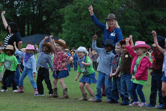 Photos by DeAnn Komanecky/Effingham NowRincon Elementary School Pre-K students perform the cowboy dance at the annual May Day celebration on Friday.