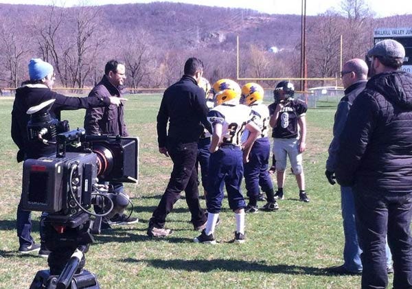 Photo Courtesy of Steve Ciasullo - A crew gets footage for a NFL Draft show opener at the Wallkill Valley Junior Rangers field by Franklin Pond.