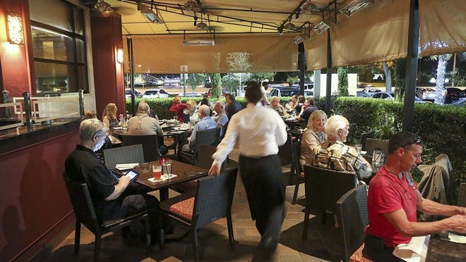 The outdoor patio at Madisons New York Grill & Bar in Boca Raton. (Damon Higgins/The Palm Beach Post)