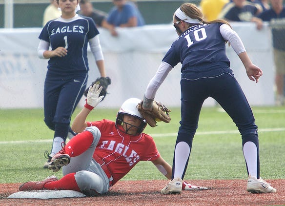 St. John's Shelbi Strickland places the tag on a Central Catholic base runner in the Lady Eagles' 9-1 Class 1A quarterfinal playoff loss on Friday afternoon at the Fastpitch Top 56 State Softball Tournament at Frasch Park in Sulphur. 
COURTESY PHOTO/American Press