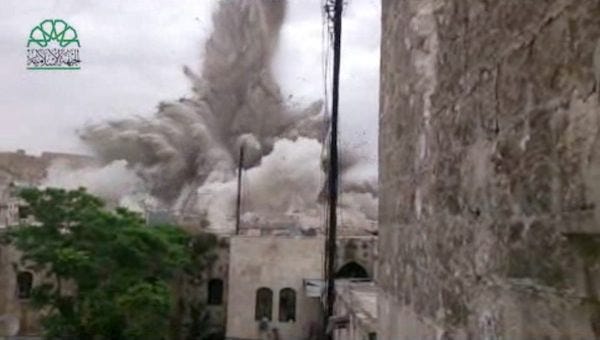 This image made from amateur video posted by Shaam News Network (SNN), an anti-Bashar Assad activist group, which has been verified and is consistent with other AP reporting, shows an explosion that destroyed the Carlton Hotel in Aleppo, Syria, Thursday, May 8, 2014. The rebel-claimed bombing Thursday in the northern Syrian city leveled the once luxurious hotel near the ancient Citadel that government troops used as a military base, causing multiple casualties, activists and militants said. THE ASSOCIATED PRESS