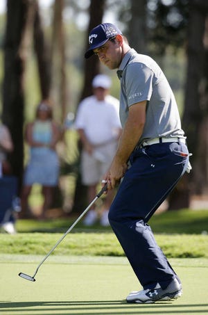 Gary Woodland watches his putts on the fifth green Thursday during the first round of The Players championship golf tournament at TPC Sawgrass in Ponte Vedra Beach, Fla.