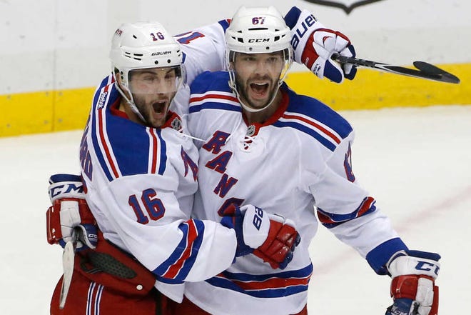 New York's Derick Brassard (left) celebrates with Benoit Pouliot after scoring one of his two goals during Game 5.