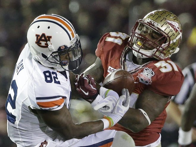 FILE - Florida State's Terrence Brooks, a Dunnellon alum, breaks up a pass intended for Auburn's Melvin Ray during the second half of the BCS National Championship game. Brooks was selected in the third round of the NFL draft by the Baltimore Ravens Friday night.