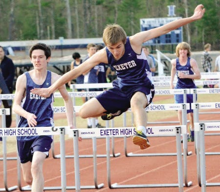 Ryan O’Leary photo 
Exeter High School’s Matt Pittendreigh clears a hurdle during Tuesday’s track and field dual meet against Winnacunnet. The Blue Hawk boys beat the Warriors 106-38.