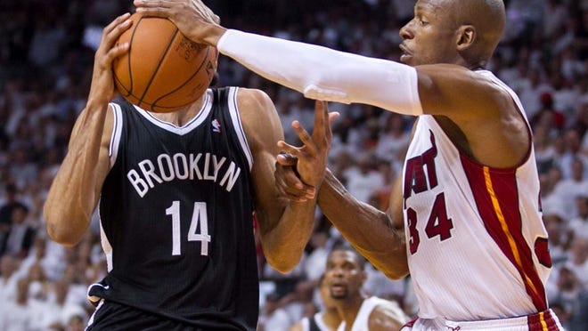 Miami Heat guard Ray Allen (34) defends Brooklyn Nets guard Shaun Livingston (14) at AmericaAirlines Arena in Miami, Florida on May 8, 2014. (Allen Eyestone / The Palm Beach Post)