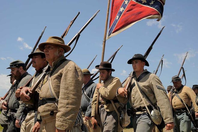 Confederate Army soldiers make their way to the battlefield during the reenactment of 'Bloody Angle' on May 3. Spotsylvania remembered the 150th Anniversary of the Battles of the Wilderness and Spotsylvania Courthouse this weekend with a reenactment.