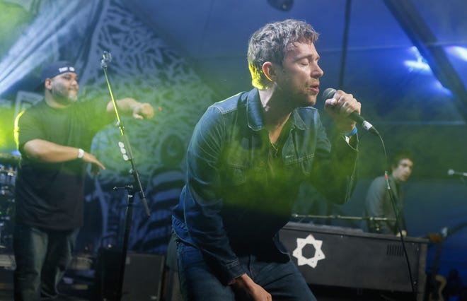 Damon Albarn, right, joined by De La Soul’s Vincent Mason, left, performs during the SXSW Music Festival in Austin, Texas, on March 14.