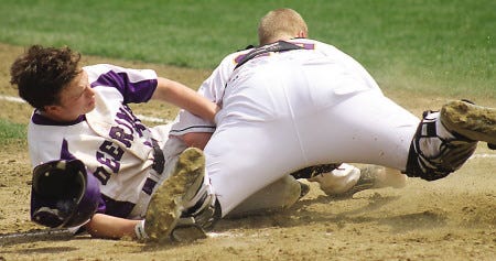 Al Pike/Foster’s Daily Democrat
Marshwood High School catcher Holden Jackman, right, is involved in a collision with Deering’s Ben Peterson during their Western Maine Class A game Saturday in South Berwick, Maine.