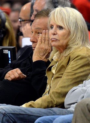 Los Angeles Clippers owner Donald Sterling, left, and his wife Shelly watch during the second half in Game 3 of an NBA basketball playoffs Western Conference semifinal against the San Antonio Spurs in Los Angeles. An attorney representing the estranged wife of Clippers owner Donald Sterling said Thursday, May 8, 2014, that she will fight to retain her 50 percent ownership stake in the team.