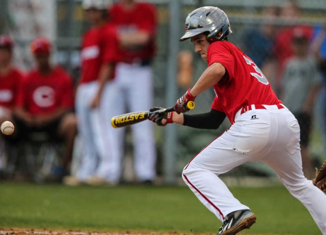 Creekside's Kyle Nuckols (3) bunts, bringing in 2 runs on an Englewood error during the second inning Thursday evening in high school regional quarterfinal baseball action at Creekside High School, St. Johns, Fla., May 1, 2014. By GARY McCULLOUGH / CORRESPONDENT