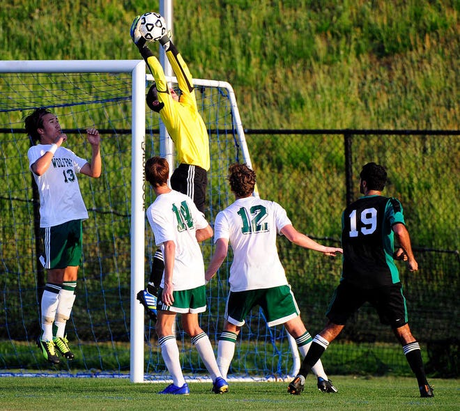 Greenbrier goalkeeper Connor Washer makes a save during the Wolfpack's 3-0 loss to McIntosh in the GHSA Class AAAAA state soccer semifinals Tuesday night.