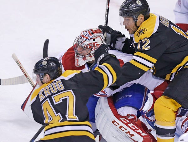 Montreal Canadiens goalie Carey Price (center) is surrounded by Boston Bruins right wing Jarome Iginla (12) and defenseman Torey Krug (47) during the teams' Eastern Conference semifinal series. Game 7 is Wednesday.
