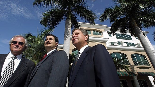 1st United Chairman Warren Orlando, CFO John Marino and President and CEO Rudy Schupp, shown in a 2003 photo, are set to receive cash payments of $6 million apiece after the bank is sold to Valley National Bancorp.