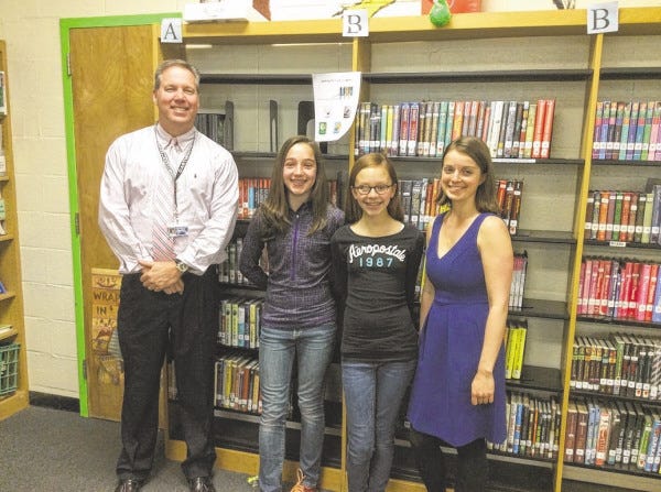 SUBMITTED PHOTO
Dartmouth Middle School wins “Lives Change @ Your Library” Student Video Contest. Pictured (l-r), Principal, Darren Doane, Charlotte Correiro, seventh grader, Reilly Leconte, seventh and Libraran Laura Gardner.