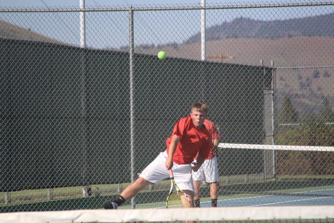 Mitchell Gould of the Yreka Miners boys tennis team during a first round Northern Section playoff team match against Shasta High of Redding on Tuesday in Yreka. Daily News Photo/Bill Choy
