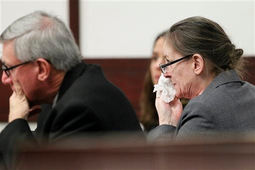 Julie Schenecker wipes her face with a tissue as she listens to her defense attorney give closing arguments before Judge Emmett Lamar Battles on Thursday, May 15, 2014 in Tampa. Schenecker, 53, is accused of killing her two teenage children Calyx, 16, and Beau, 13, in 2011. The jury began deliberations Thursday afternoon. They will dedice whether a former Army officer's wife knew what she was doing when she killed her two teenagers or whether she was insane at the time and couldn't tell right from wrong. (AP Photo/Tampa Bay Times, Daniel Wallace,Pool)