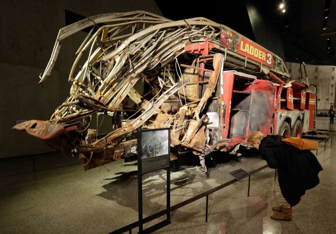 The remains of Fire Dept. of New York Ladder Company 3's truck are displayed at the National Sept. 11 Memorial Museum, Wednesday, May 14, 2014, in New York. The museum is a monument to how the Sept. 11 terror attacks shaped history, from its heart-wrenching artifacts to the underground space that houses them amid the remnants of the fallen twin towers' foundations. It also reflects the complexity of crafting a public understanding of the terrorist attacks and reconceiving ground zero. (AP Photo)